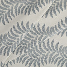 Tonic Living Swoon Sunbrella Denim fabric featuring a soft botanical stripe in blue and white tones.