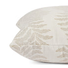 Close up of Tonic Living Swoon Sand cushion highlighting its soft woven texture and botanical stripe.