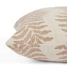 Close up of Tonic Living Swoon Terracotta cushion highlighting its soft woven texture and botanical stripe.