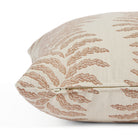Side zipper detail of Tonic Living Swoon 20x20 outdoor toss pillow in terracotta and white stripe.