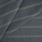 Tonic Living Talisman Sunbrella Denim blue performance fabric featuring a subtle embroidered stripe with geometric interest.