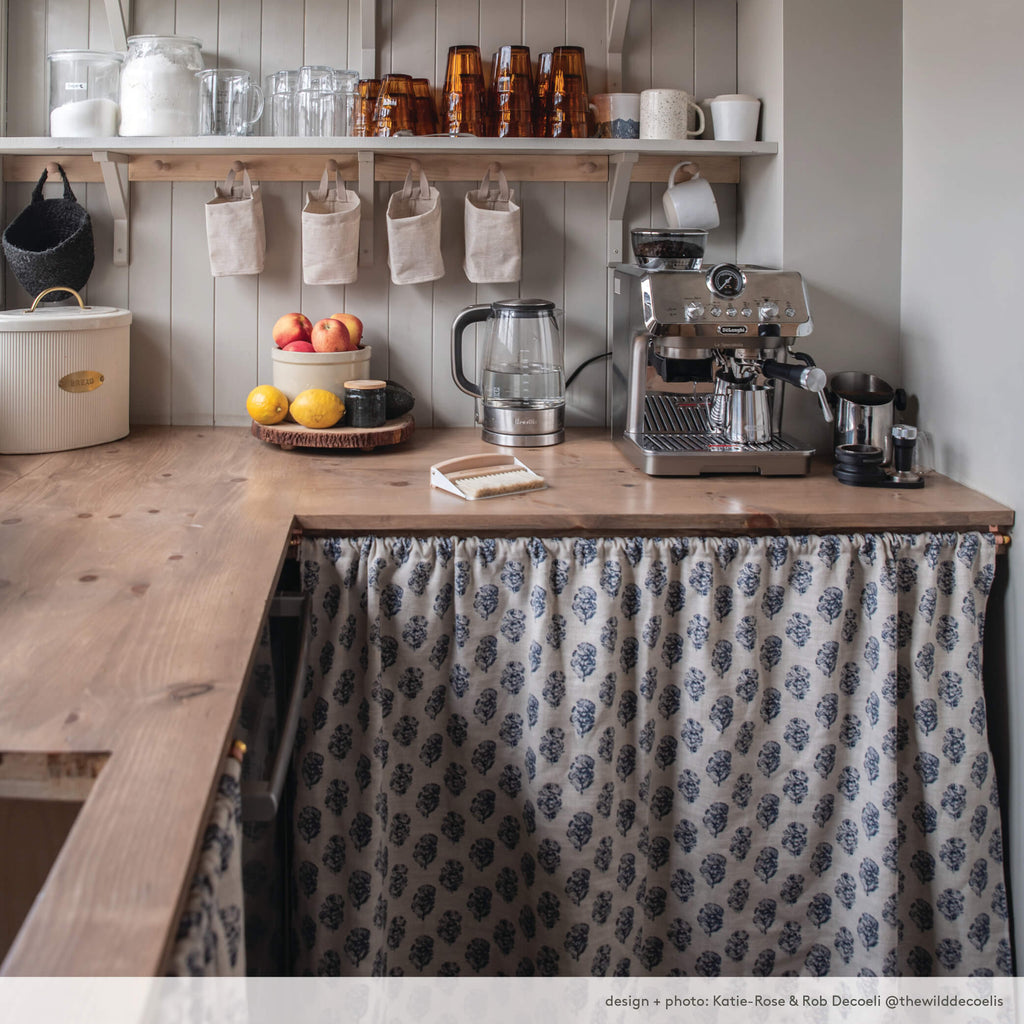 Country kitchen pantry, at the home of @thewilddecoelis, using zola blockprint fabric as an under-counter cafe curtain to conceal storage. 