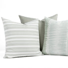 A selection of soft sage green, aqua and white indoor/outdoor throw pillows from Tonic Living.