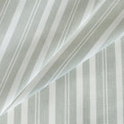 Tranquil Sage Sunbrella Outdoor Fabric from Tonic Living, a soft green and white striped upholstery fabric.