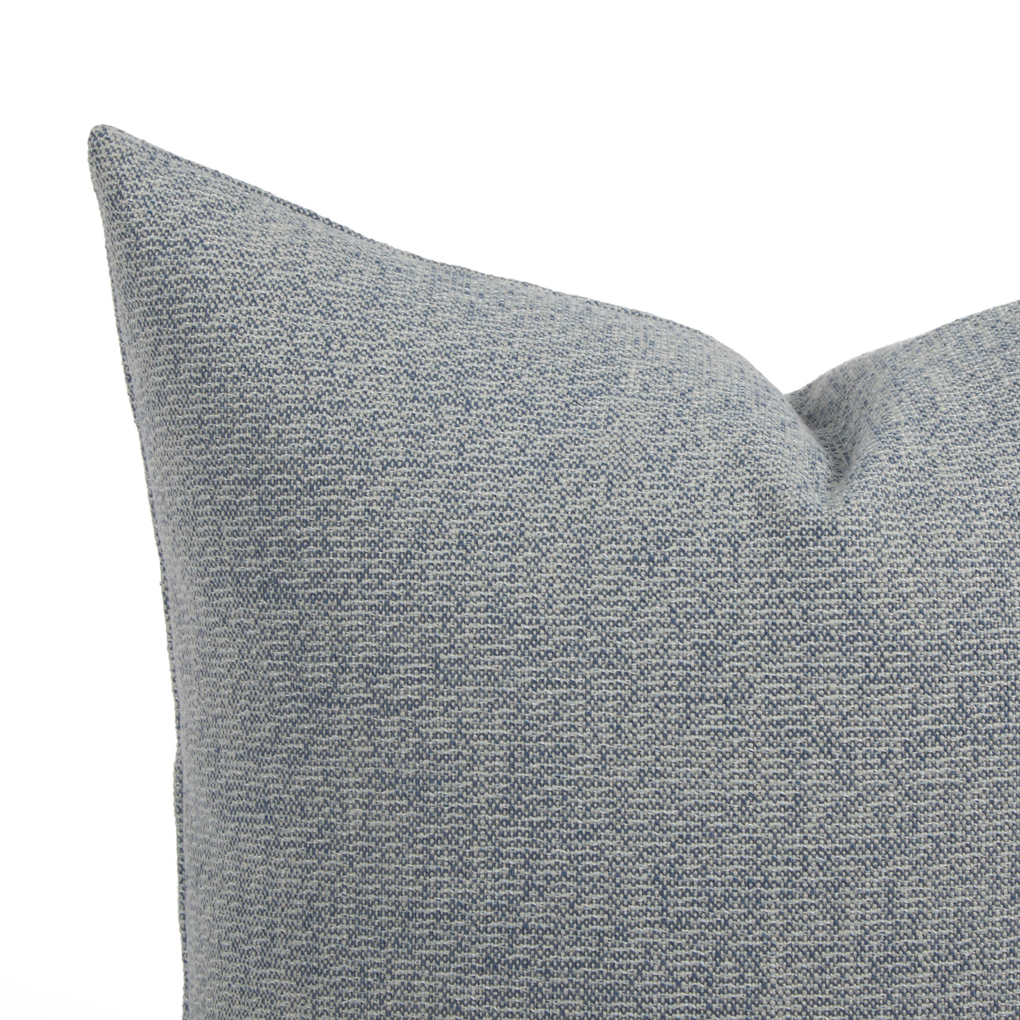Close up of Tonic Living Troy indoor outdoor cushion showing solid blue textured fabric.