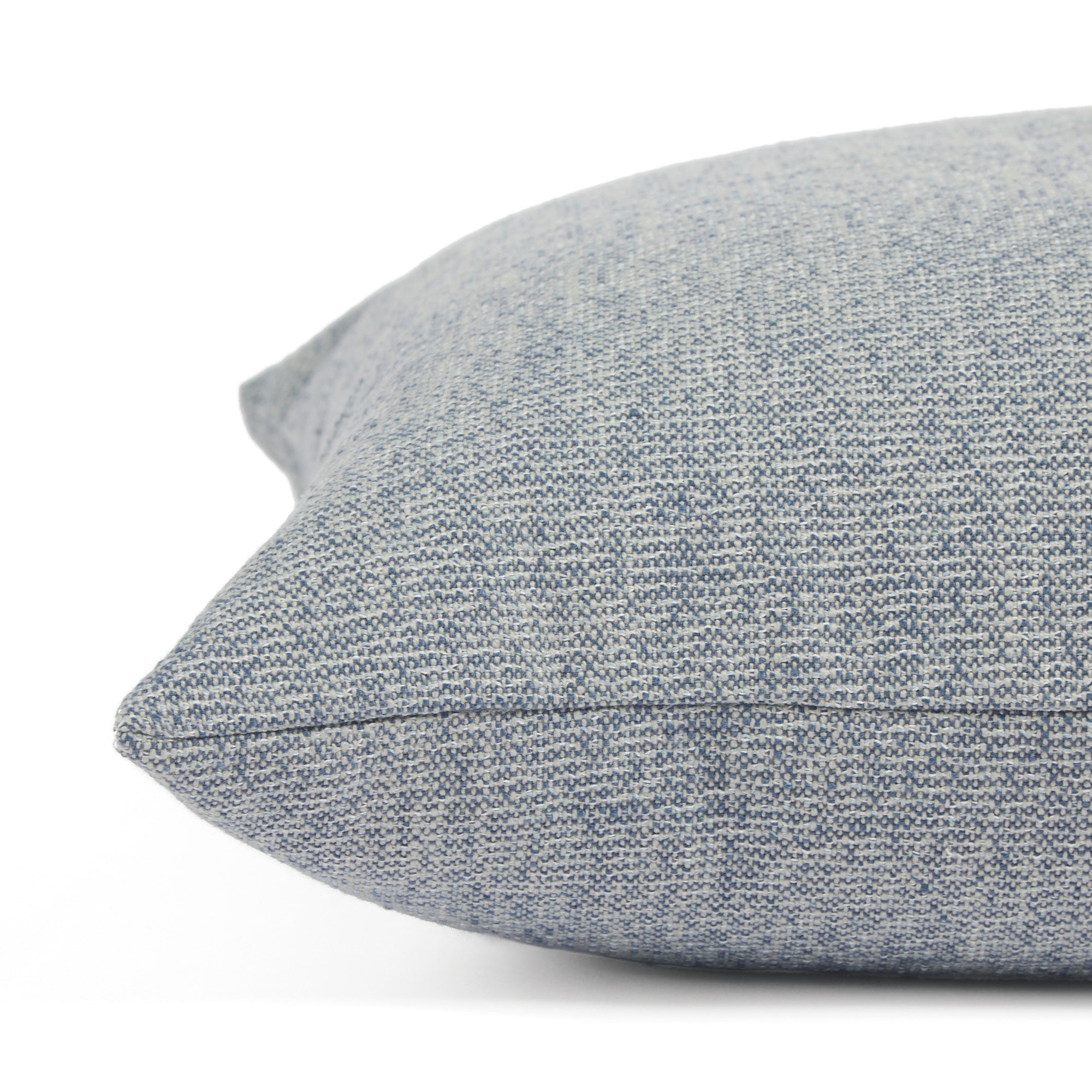 Side view of Tonic Living Troy Denim decorative cushion highlighting its blue textured indoor/outdoor fabric.