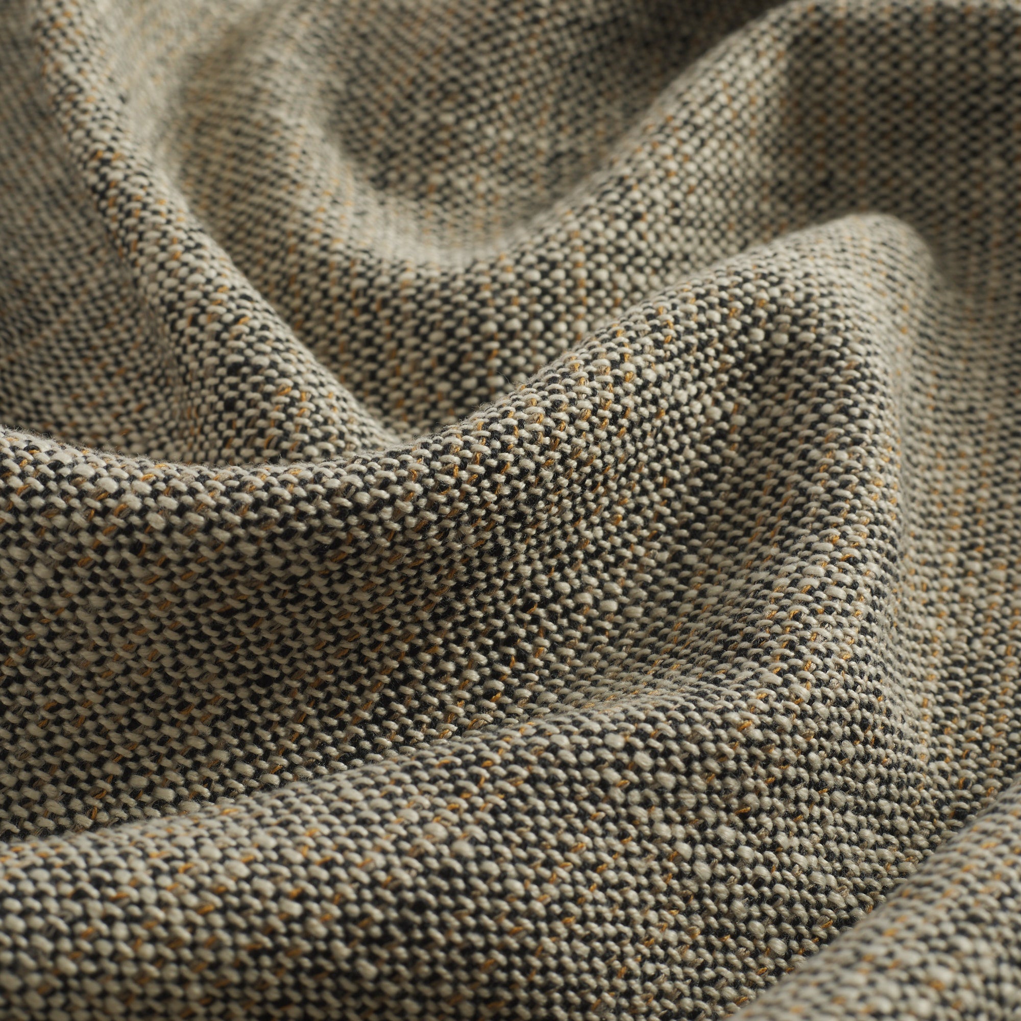 Close up of Tonic Living Troy InsideOut Sable performance fabric highlighting its textured, linen-inspired weave in neutral tones.