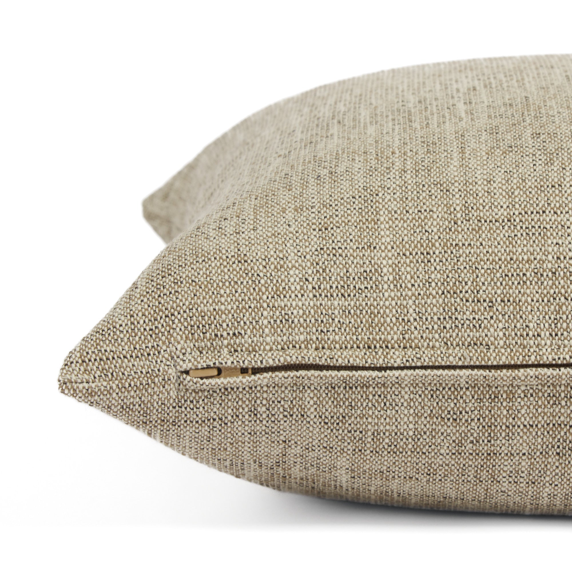 Side zipper detail of Tonic Living Troy 22x22 outdoor toss pillow in warm beige and brown tones.