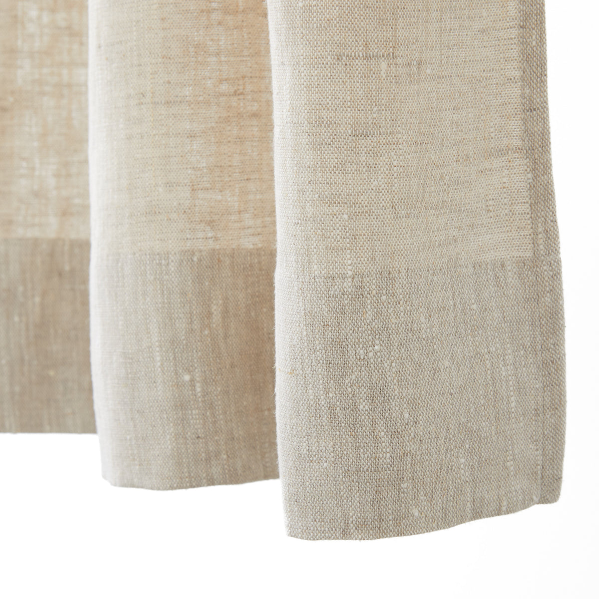 Bottom hem detail of Tonic Living Tuscany Linen Shower Curtain in Oatmeal Slub showing its tailored finish and natural linen texture.