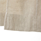 Inside bottom hem detail of Tonic Living Tuscany Linen Shower Curtain in Oatmeal Slub showing the finished linen construction.