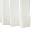 Bottom hem detail of Tonic Living Tuscany Linen Shower Curtain in Oyster showing its tailored finish and warm white linen texture.