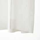 Inside bottom hem detail of Tonic Living Tuscany Linen Shower Curtain in Oyster showing the finished linen construction.