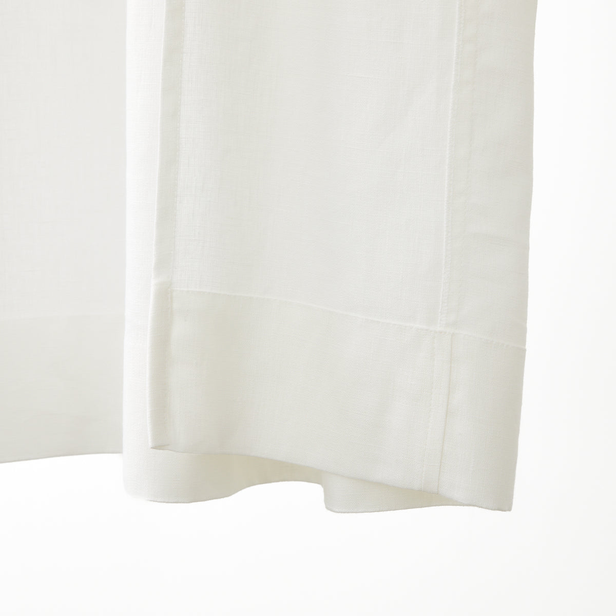 Inside bottom hem detail of Tonic Living Tuscany Linen Shower Curtain in Oyster showing the finished linen construction.