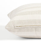 Side zipper detail of Tonic Living Vera Stripe 20x20 outdoor toss pillow in a soft white tone-on-tone stripe.