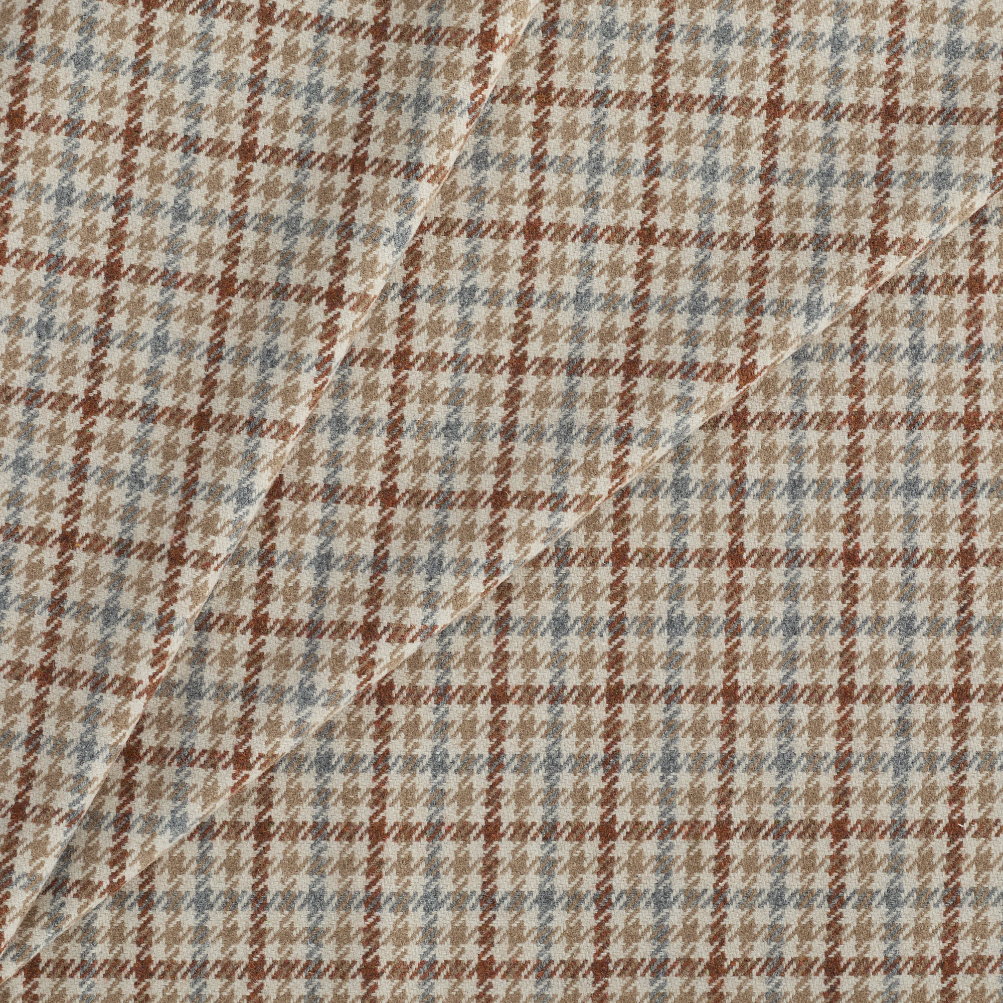 Vesper Paprika houndstooth check fabric in beige, blue, and brown for upholstery and decor.