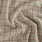 Vesper Paprika plaid home decor fabric with a beige, chambray blue, and cinnamon palette.