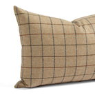 Close up of Tonic Living Walker Plaid Camel lumbar pillow showing brown and navy windowpane lines with a fine herringbone weave.