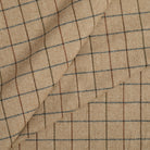 Tonic Living Walker Plaid Camel multi-use fabric featuring a classic windowpane check in rich camel and brown tones.