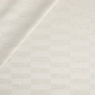 Tonic Living Webster Fabric in Buff, a cream and beige upholstery fabric with modern checkerboard pattern.