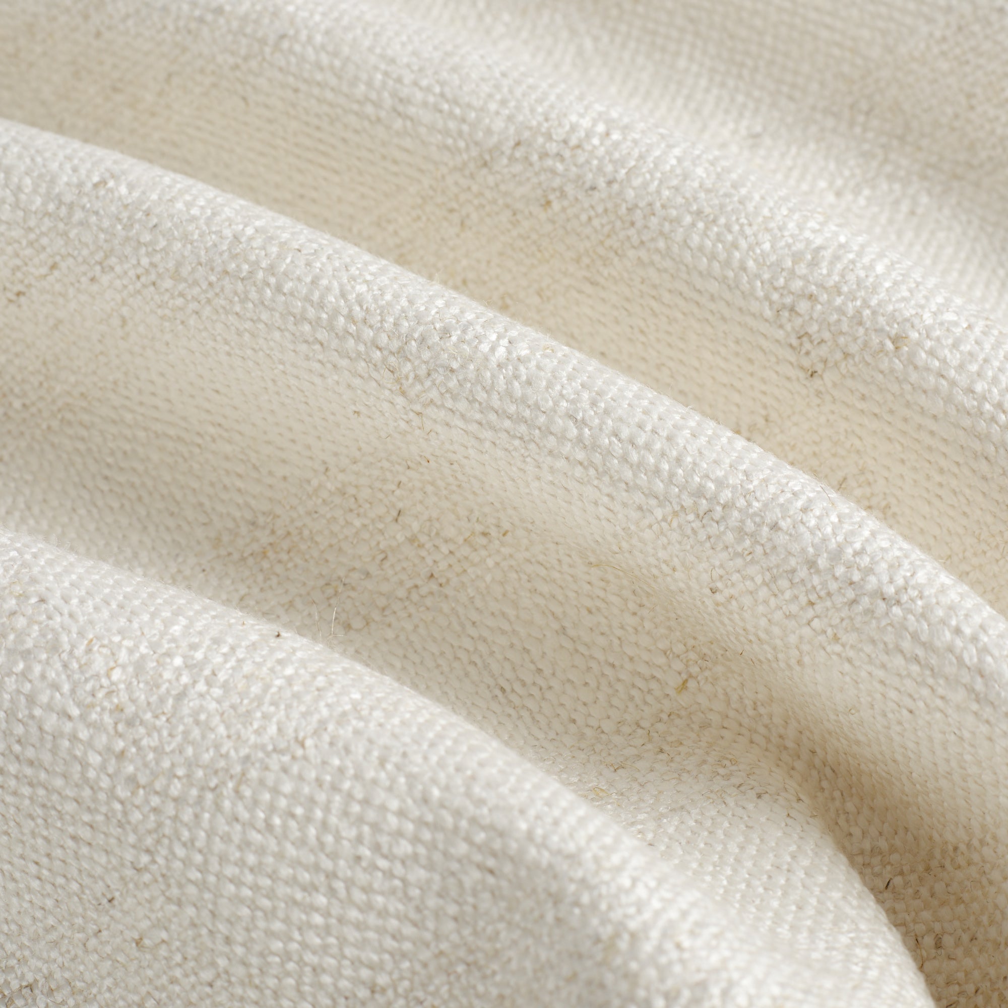 Close up of Tonic Living Webster Buff fabric showing cream and beige checkerboard detail.