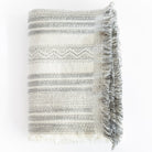 a cream and black wabi sabi striped throw blanket