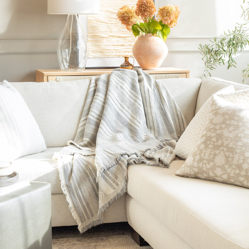 neutral designer home decor : throw pillow and throw blanket from Tonic Living