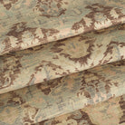 Tonic Living Zuri Driftwood fabric shown as Roman shades featuring a distressed ornamental medallion design.