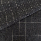Dundee Fabric, Sable, a cream grid on dark grey ground fabric from Tonic Living