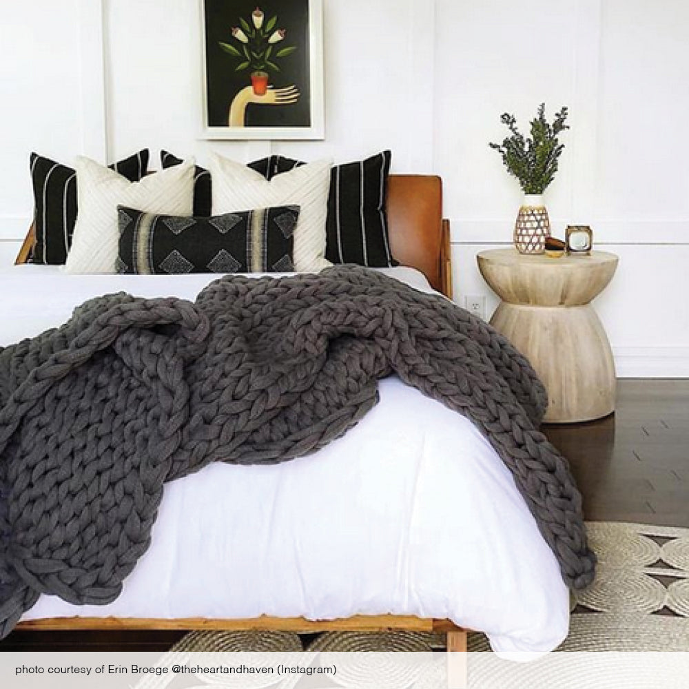 The Heart and Haven bedroom with black and cream pillows