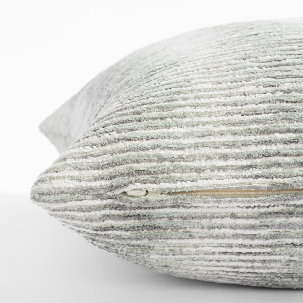 a soft cream, aqua green and grey chenille stripe throw pillow : close up zipper view