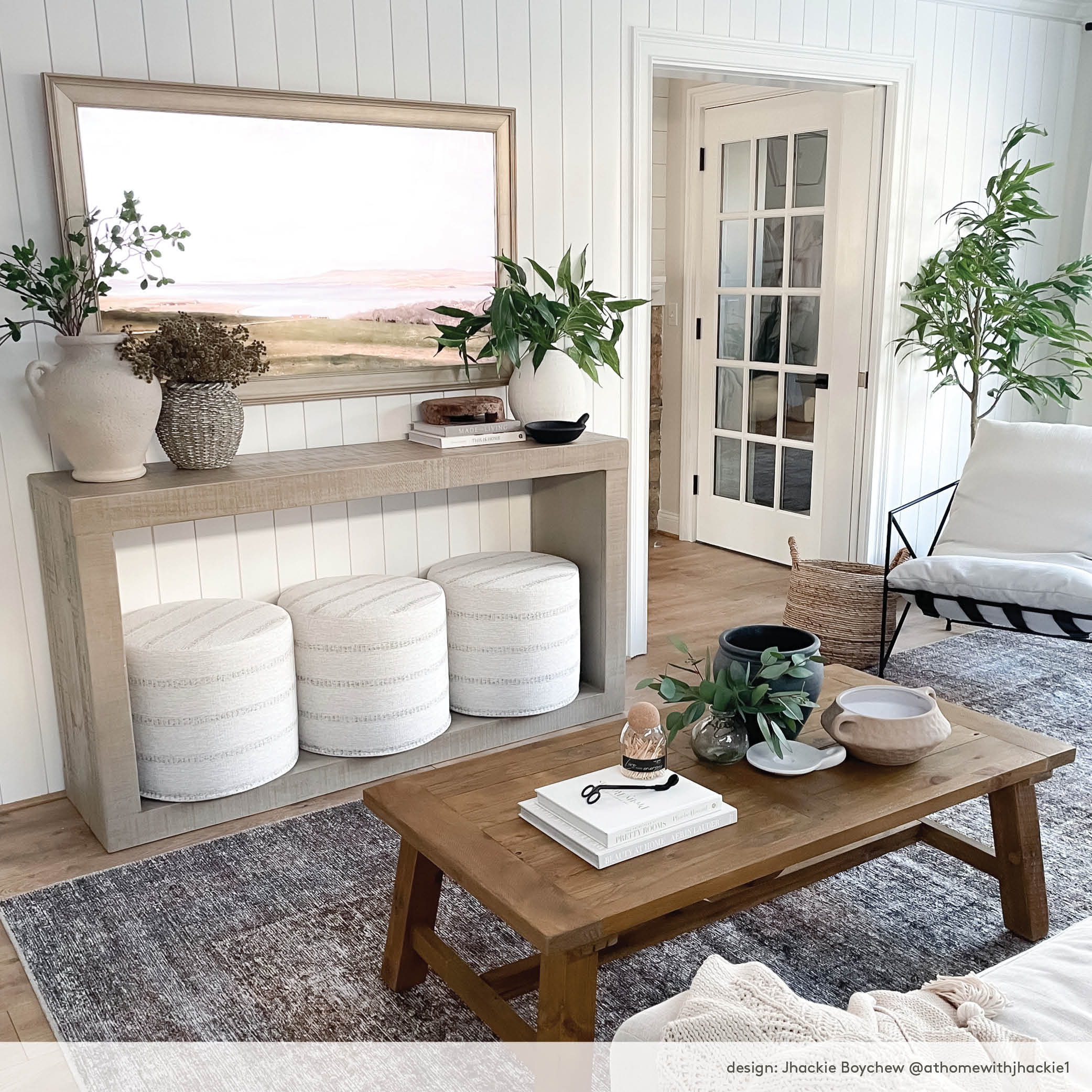 modern farmhouse living room: wood console table with durado ottomans and Samsung Frame TV