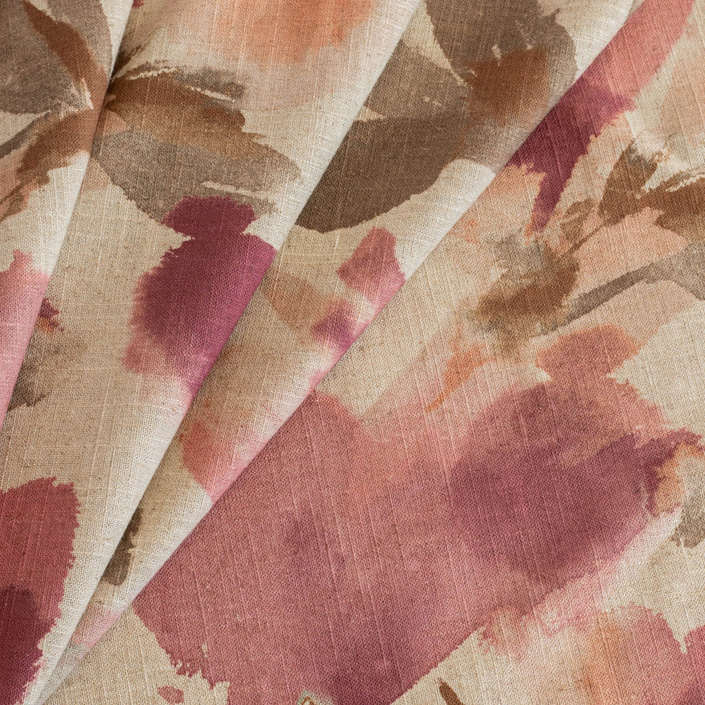 a painterly floral print fabric in an earthy pink, coral and brown 