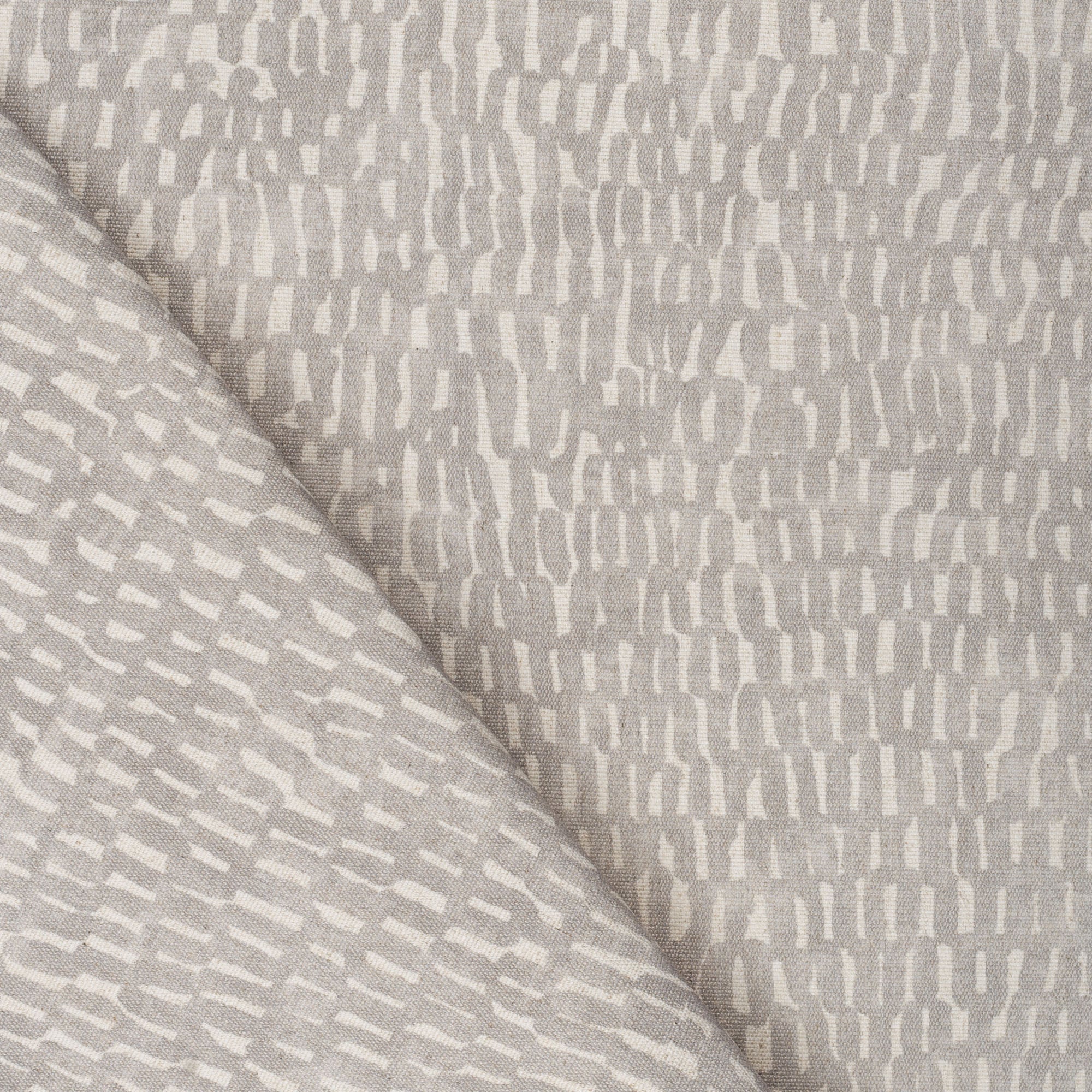 Avareno Silver, a light grey and sandy beige small scale abstract print fabric from Tonic Living 