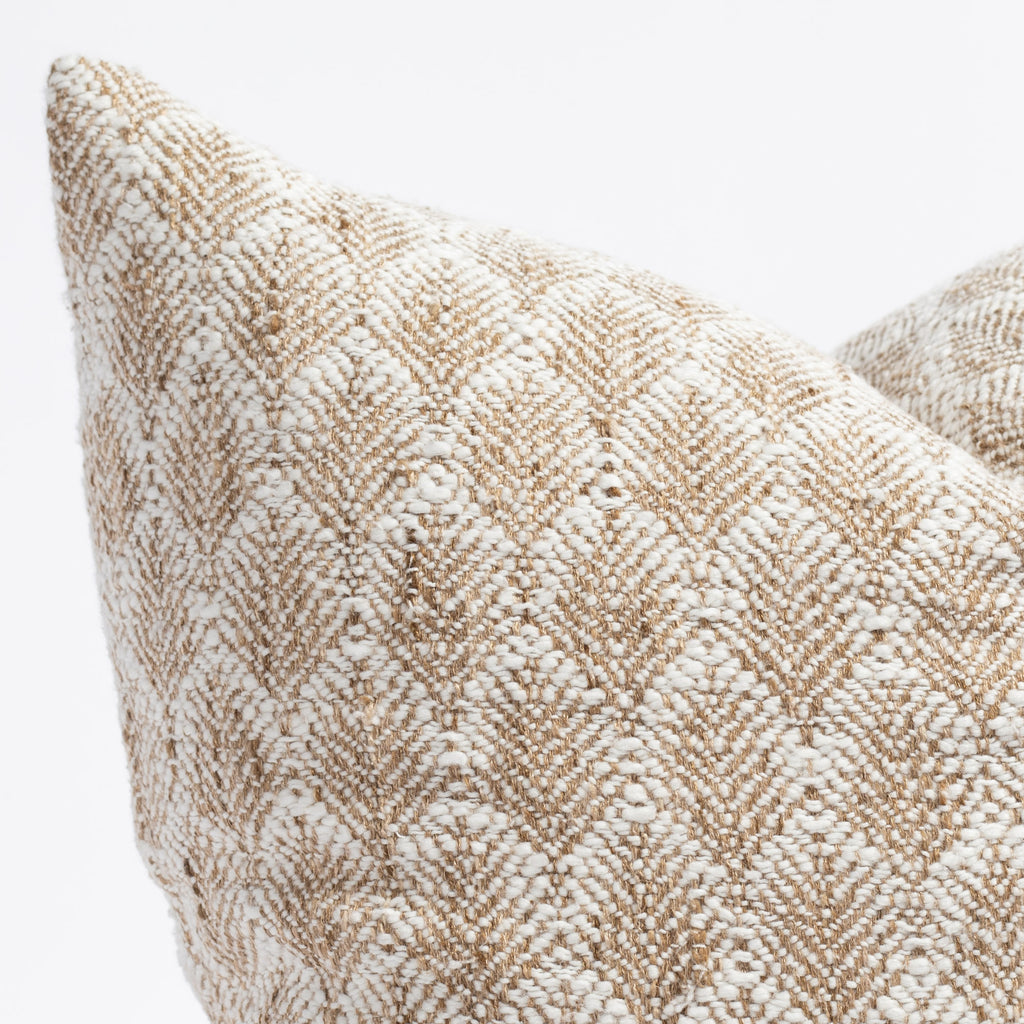 a creamy white and light brown nubbly wheat sheaf patterned decorative pillow : close up photo