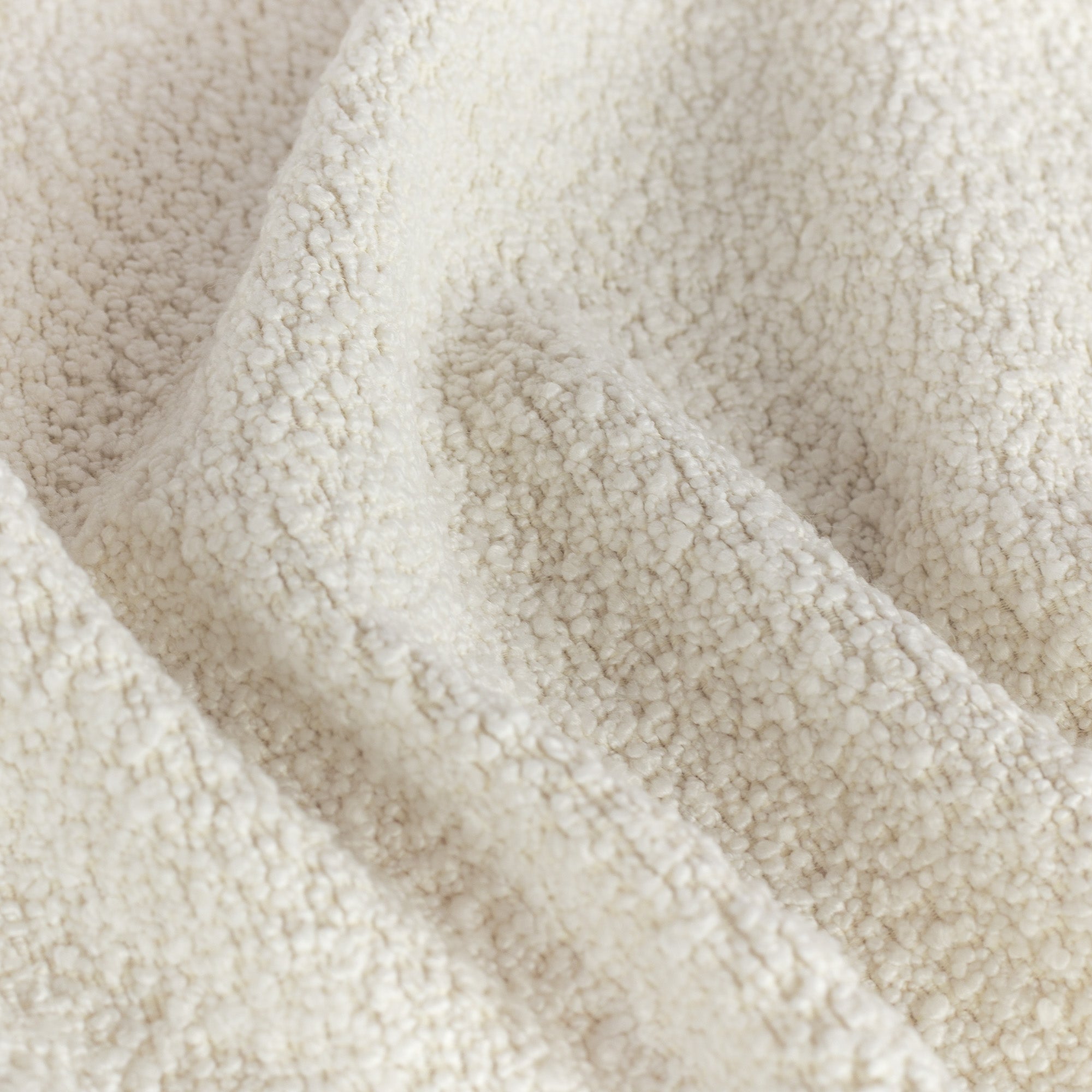 Cambie Chalk, a creamy, off-white boucle upholstery fabric from Tonic Living