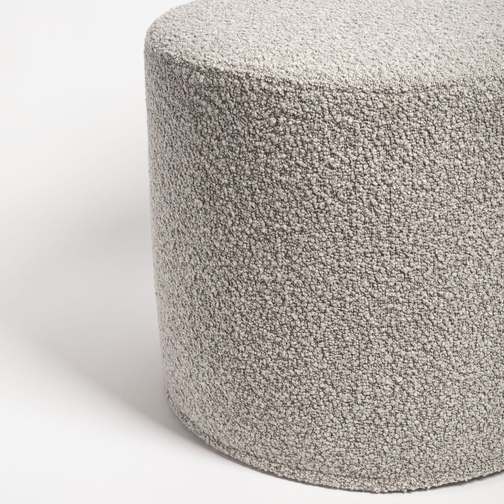 Cambie Boucle Silver Mink Ottoman, a warm grey boucle fabric round ottoman : close up side