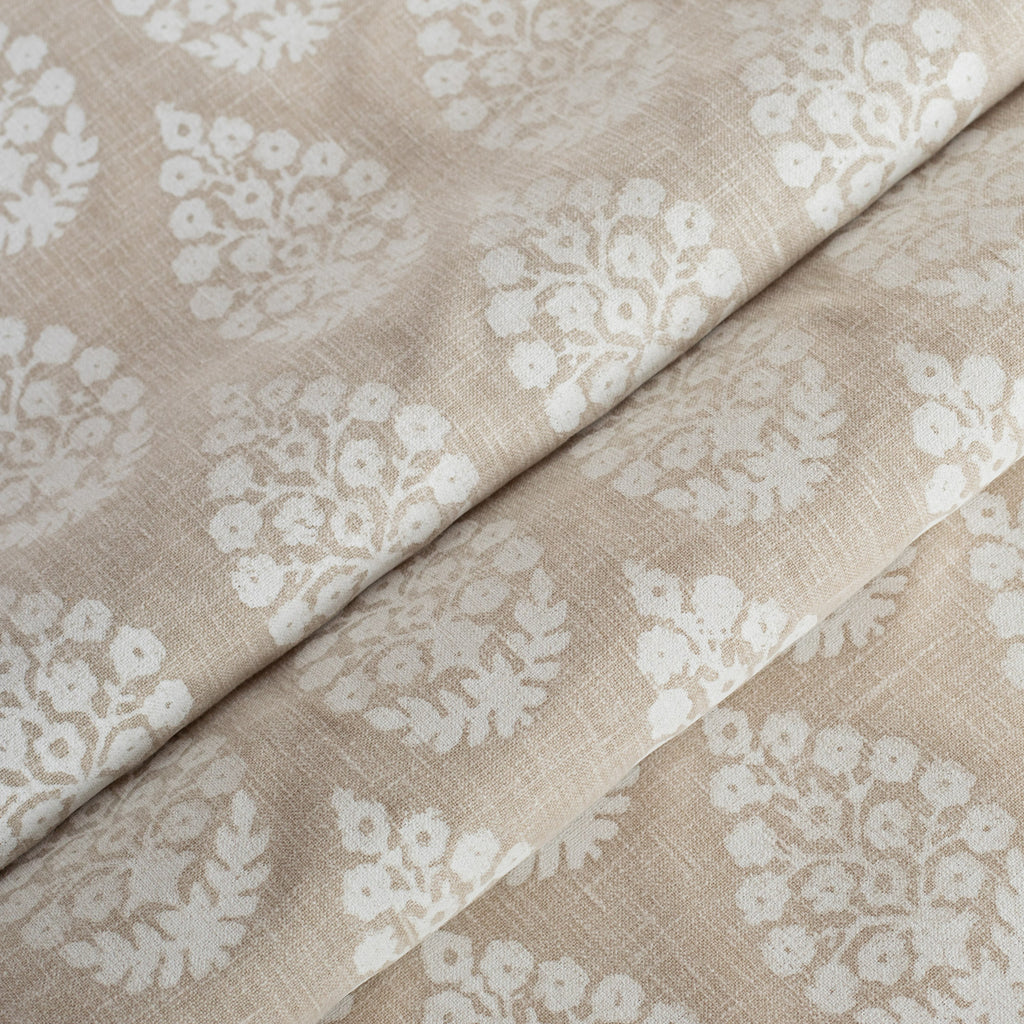 a white and beige block print fabric