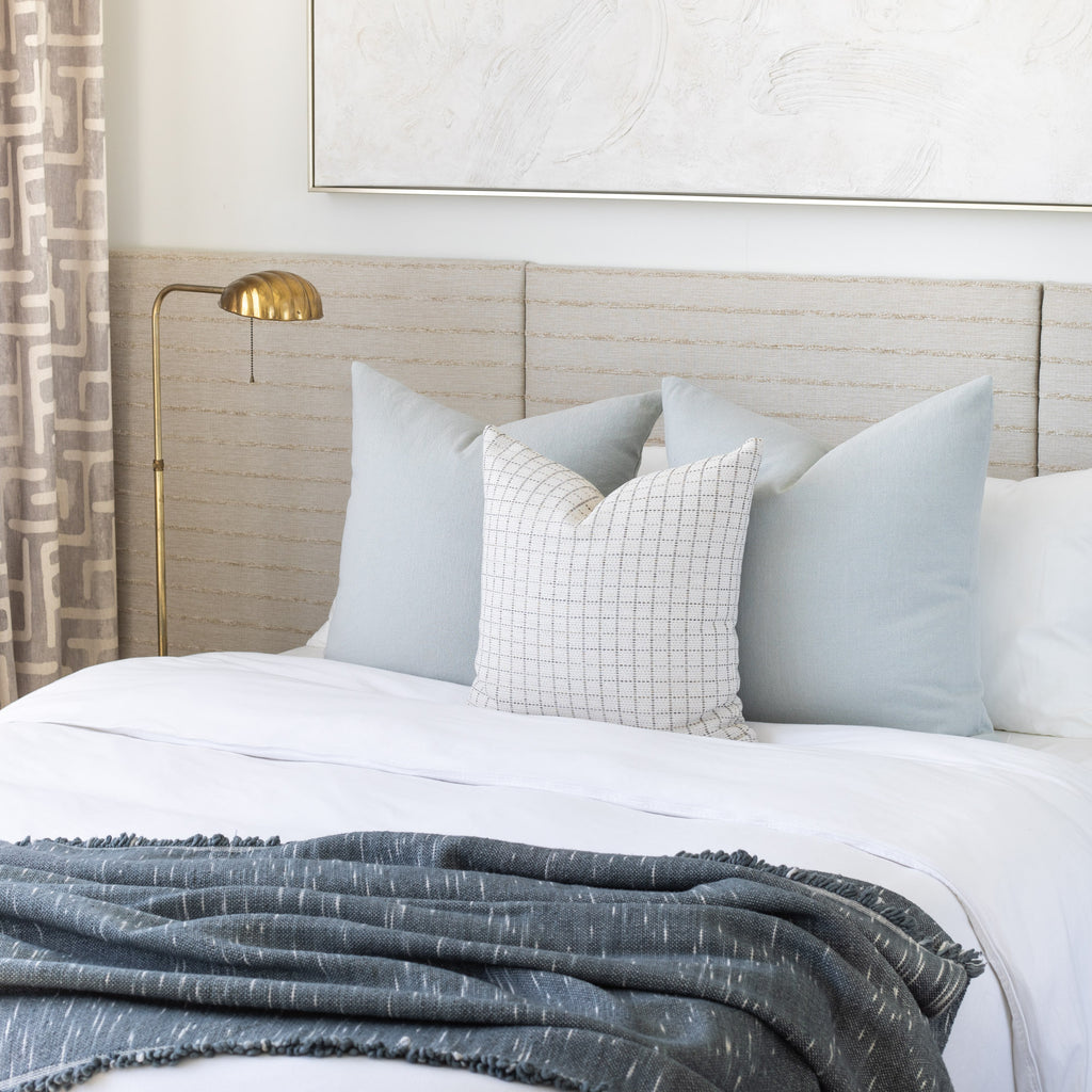 Bed pillow combination: Cleary 24x24 Mist pillows with Keely Check Birch pillow. Rafael stone blue throw on bed.