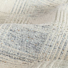 a light grey and denim blue plaid fabric : close up view