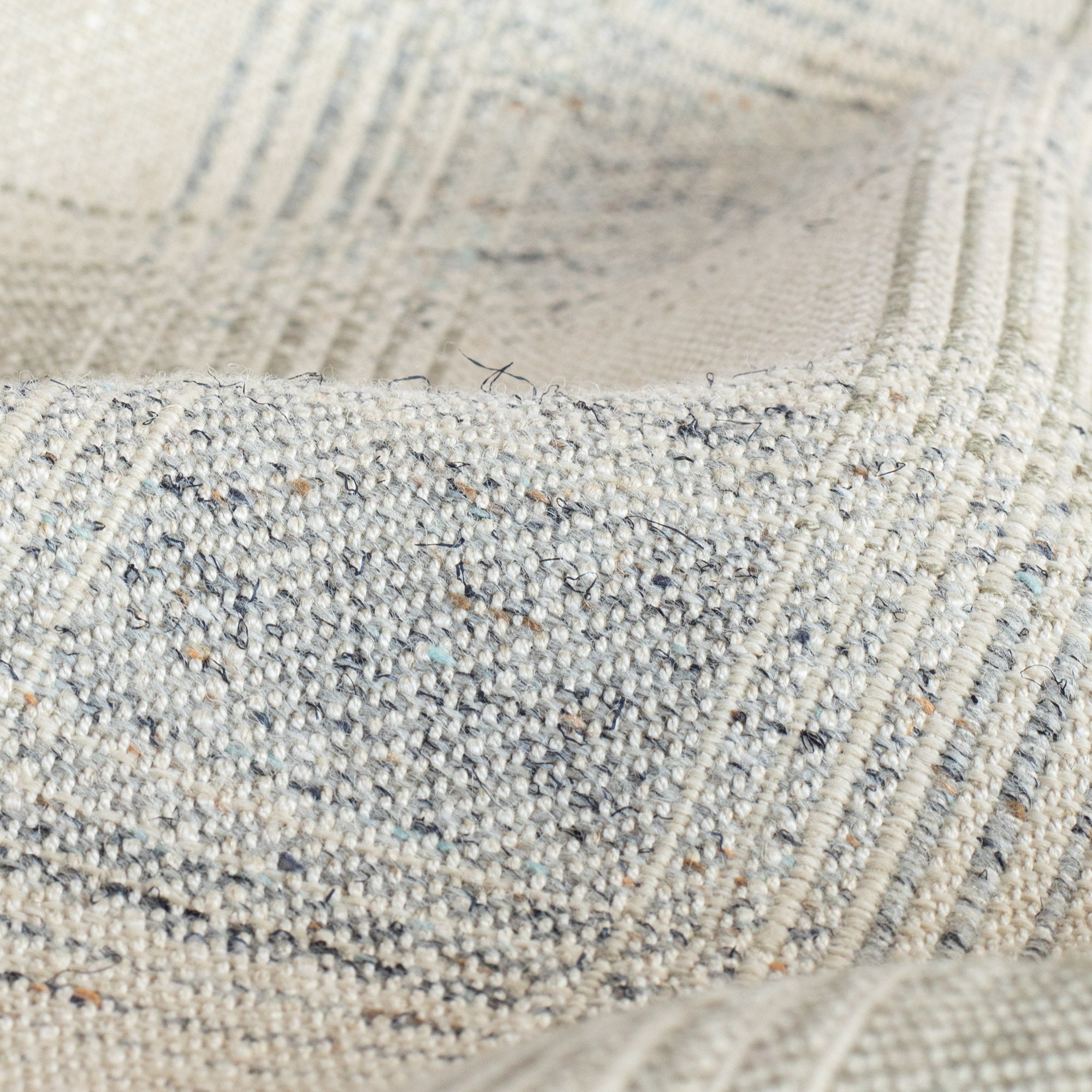 a light grey and denim blue plaid fabric : close up view