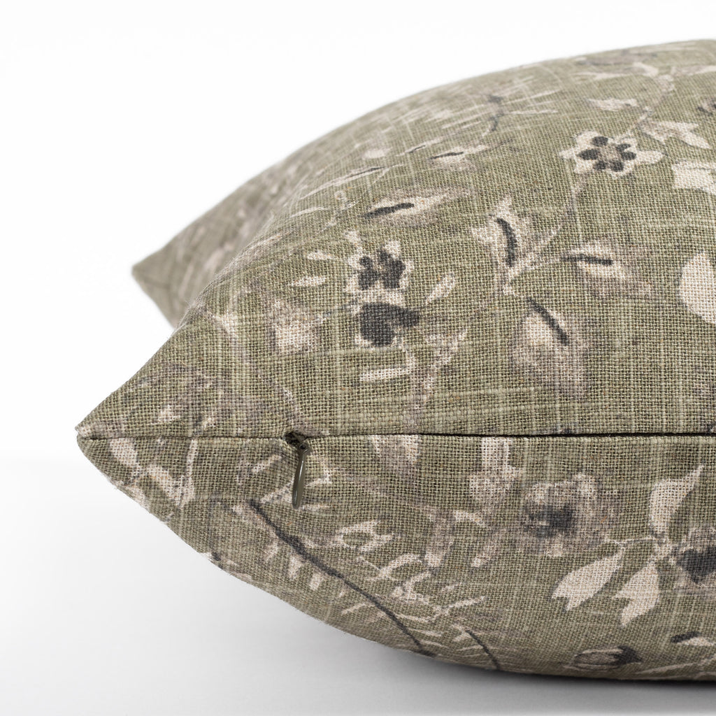 a mossy green vintage flora and fauna print throw pillows : close up zipper detail