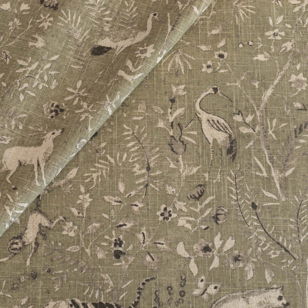a moss green botanical and exotic animal patterned linen blend fabric 