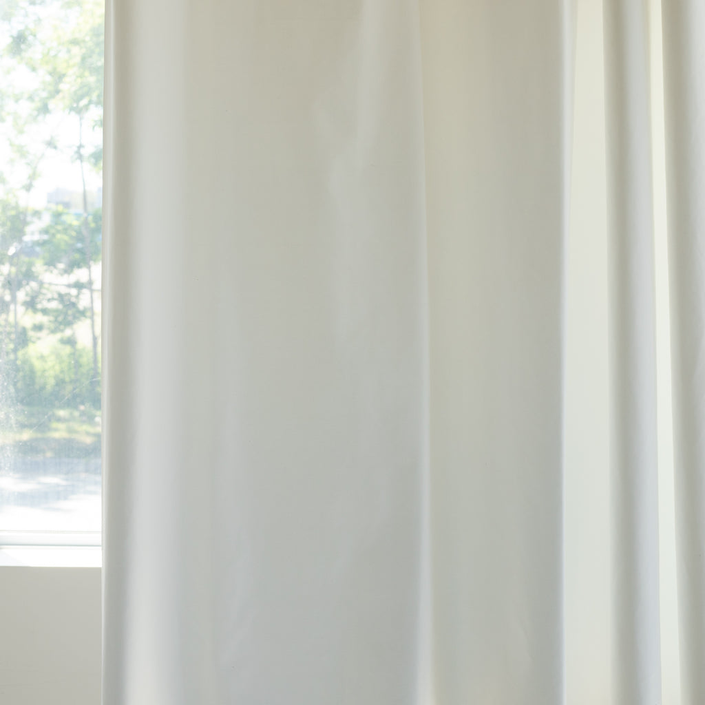 White dim out lining by Tonic Living for drapery, curtains and roman blinds