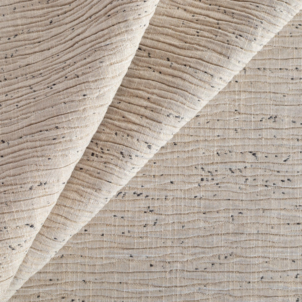 a textured flax beige upholstery fabric with flecks of grey