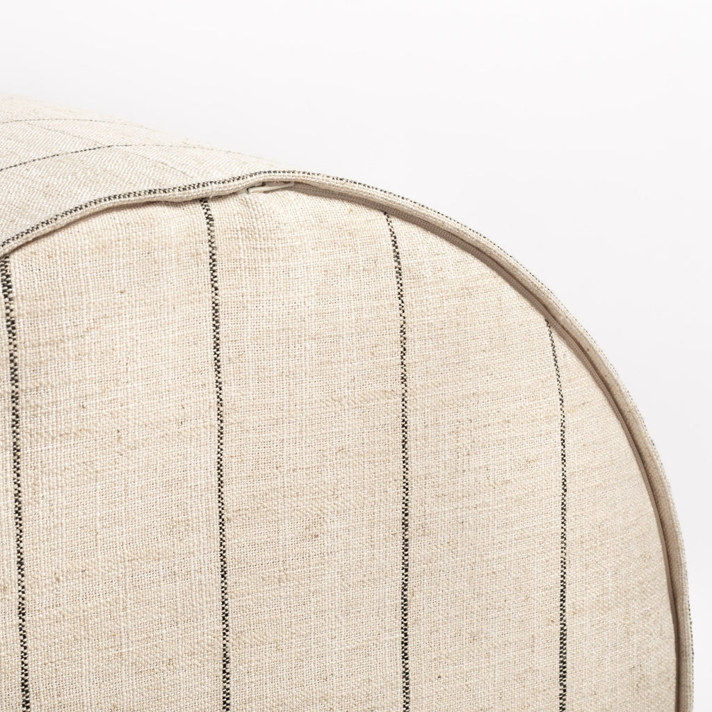 Dunrobin Round Ottoman Burlap, a beige with black stripe fabric round ottoman : close up of bottom zip