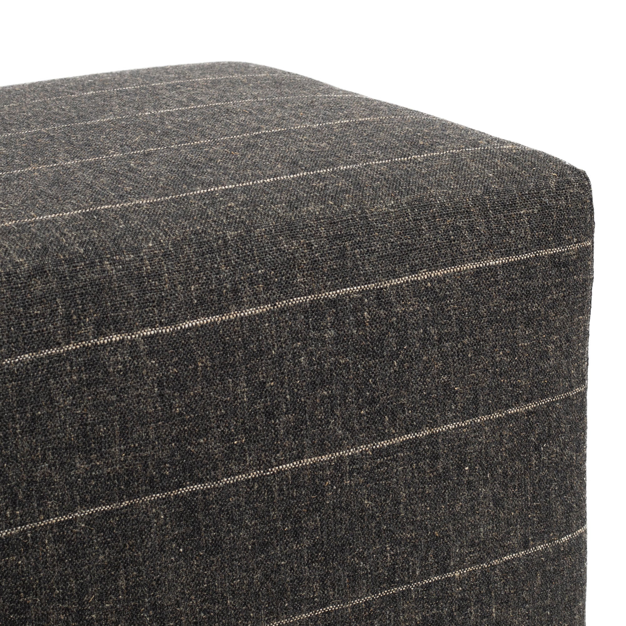 a charcoal grey and tan stripe cube ottoman : top detail shot