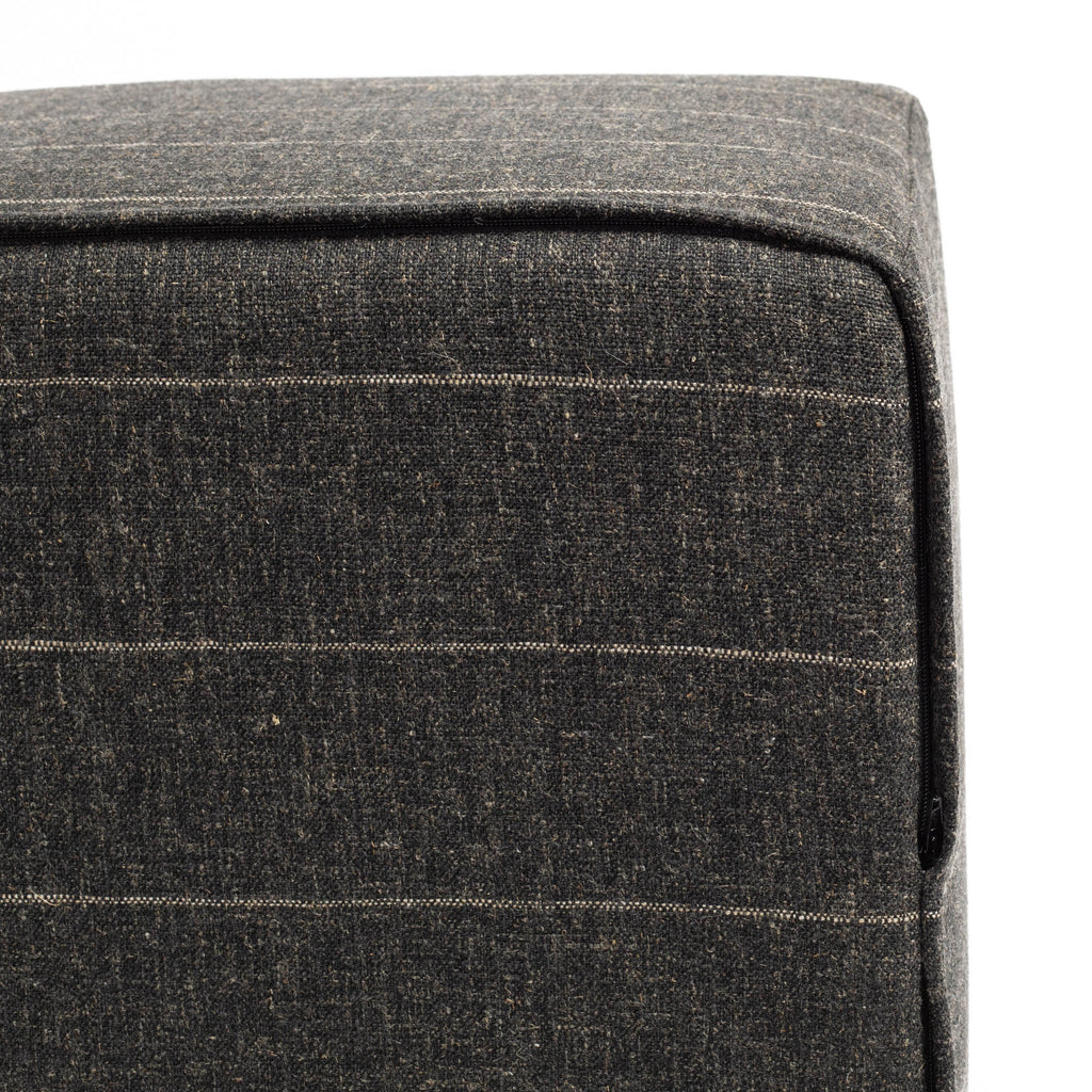 a charcoal grey and tan stripe cube ottoman : bottom zipper detail