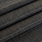 a charcoal grey and tan stripe upholstery fabric