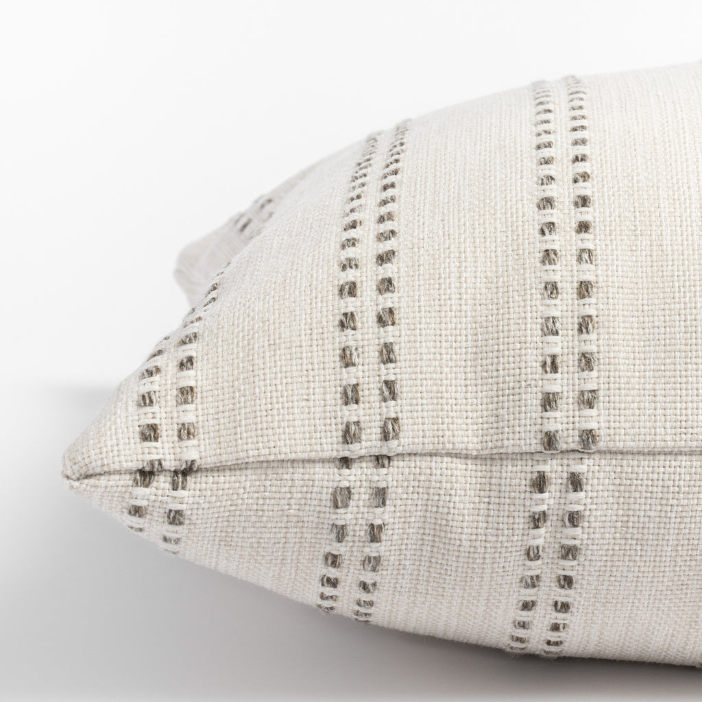 Elodie Felt, a cream with beige vertical dot stripes lumbar pillow : close up side view