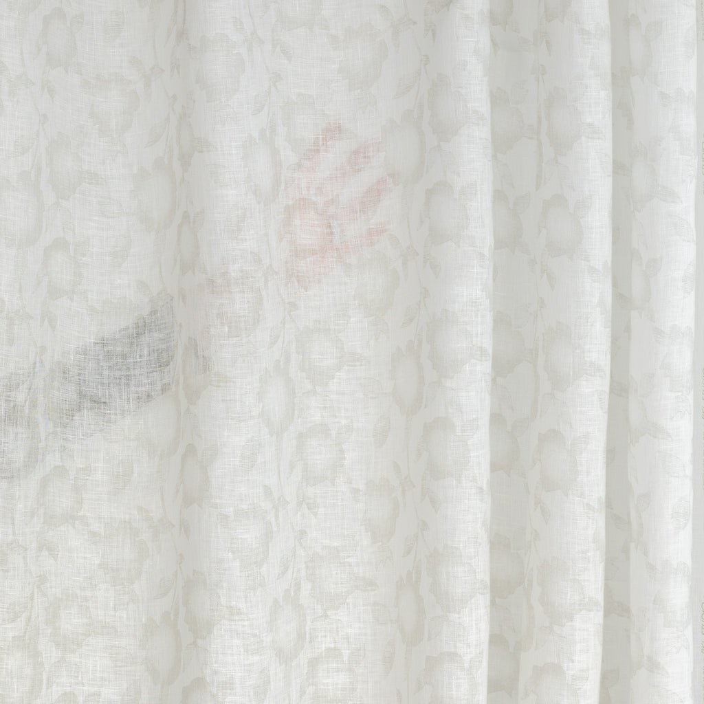 a soft white and beige floral print linen sheer drapery fabric